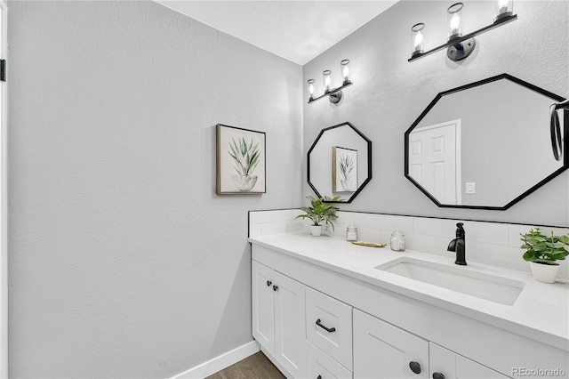 bathroom with hardwood / wood-style flooring and vanity