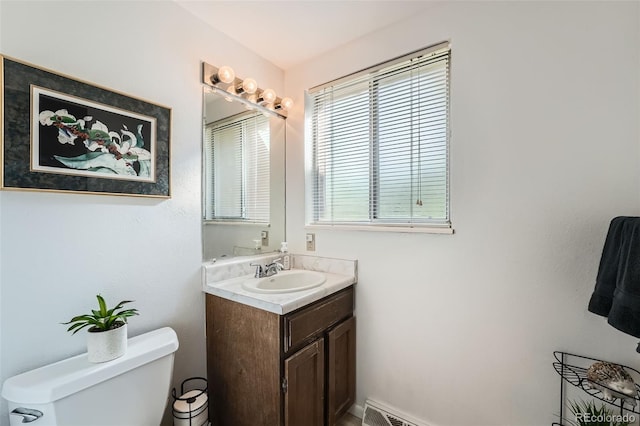 13934 W Warren Dr, Lakewood, CO 80228 - bathroom featuring toilet and vanity