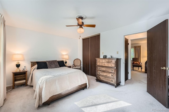 13934 W Warren Dr, Lakewood, CO 80228 - bedroom featuring a closet, light colored carpet, and a ceiling fan