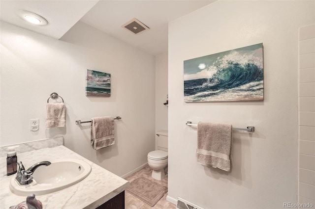 13934 W Warren Dr, Lakewood, CO 80228 - bathroom featuring toilet and vanity