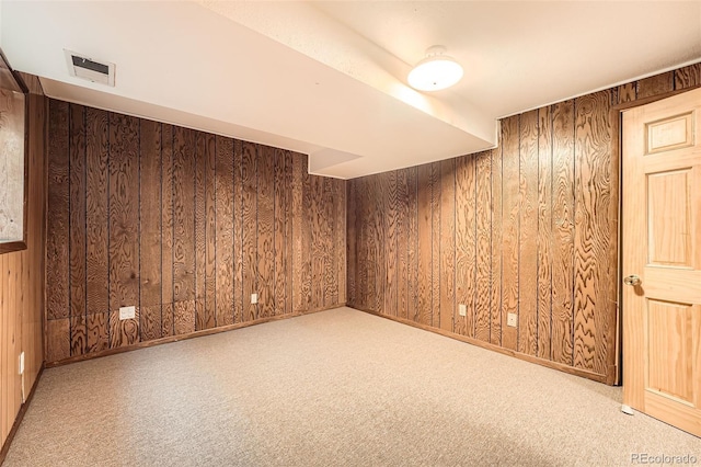 13934 W Warren Dr, Lakewood, CO 80228 - carpeted spare room featuring wood walls