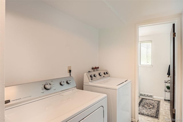 13934 W Warren Dr, Lakewood, CO 80228 - laundry room featuring washer and dryer and baseboards