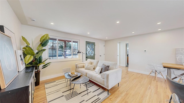 living room with light hardwood / wood-style flooring