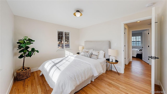 bedroom featuring wood-type flooring