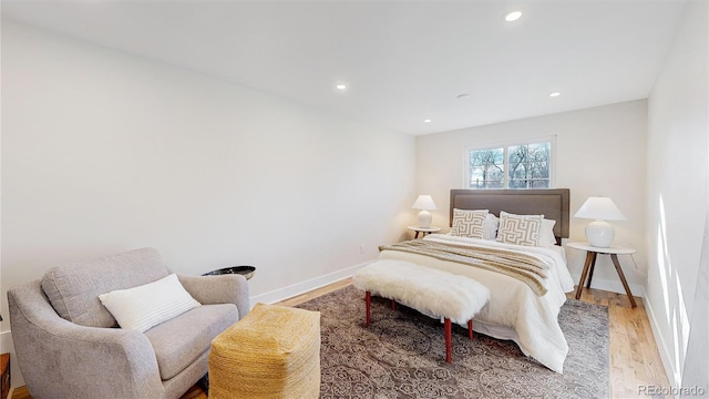 bedroom with hardwood / wood-style floors