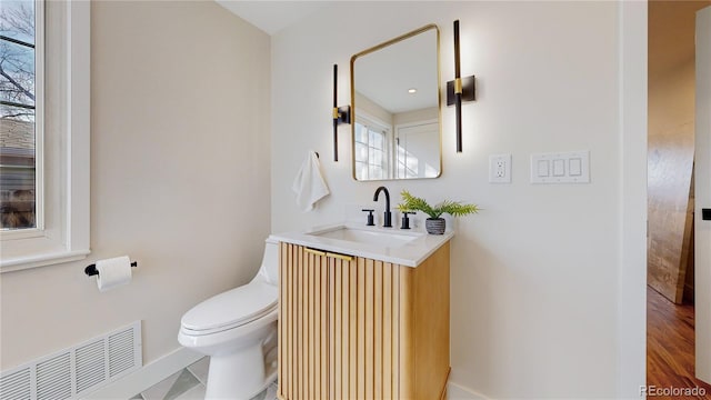 bathroom with vanity and toilet