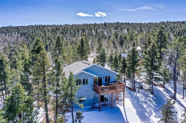 birds eye view of property featuring a wooded view