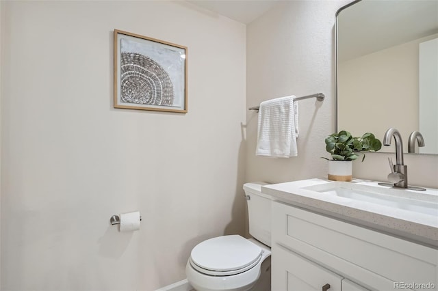 half bath with vanity and toilet