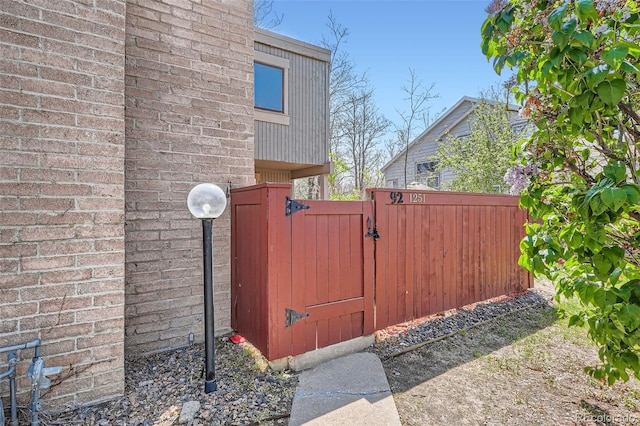 view of gate featuring fence