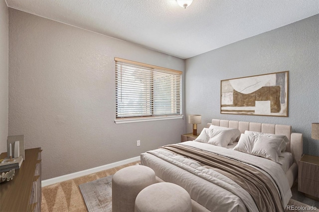 carpeted bedroom with a textured ceiling