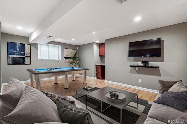 living room featuring pool table and light hardwood / wood-style flooring