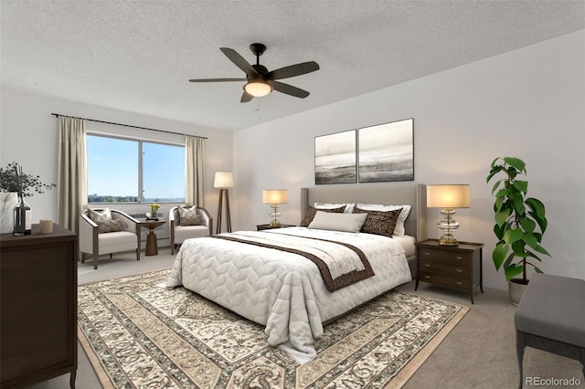 carpeted bedroom featuring ceiling fan and a textured ceiling