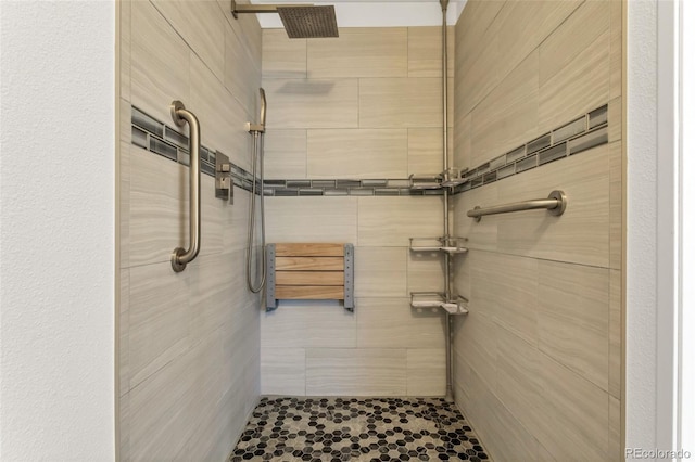 bathroom with tiled shower