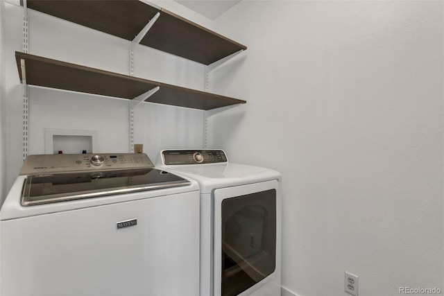 laundry room with independent washer and dryer