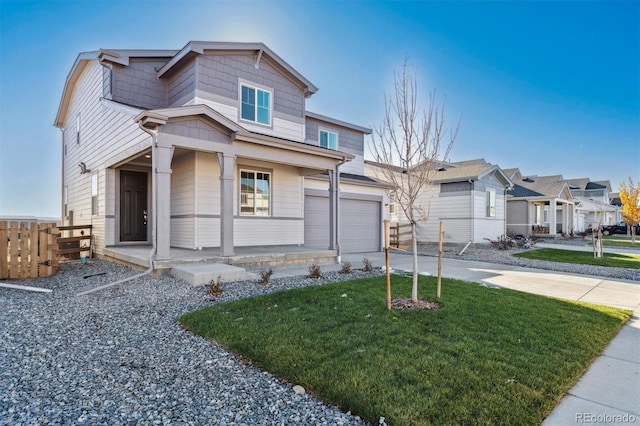 view of front of house with a front yard and a garage