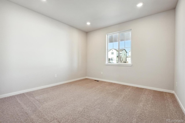 empty room featuring carpet floors