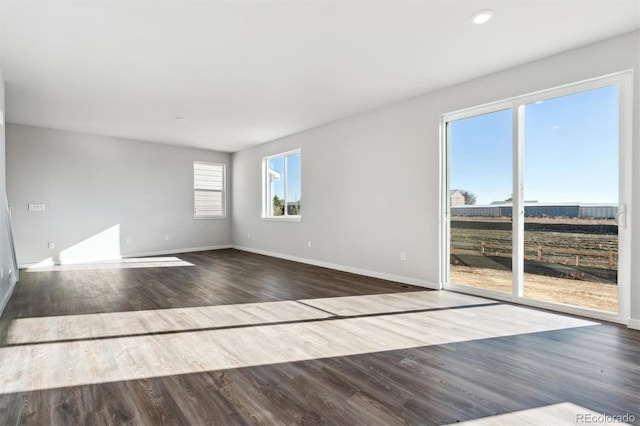 empty room featuring wood-type flooring