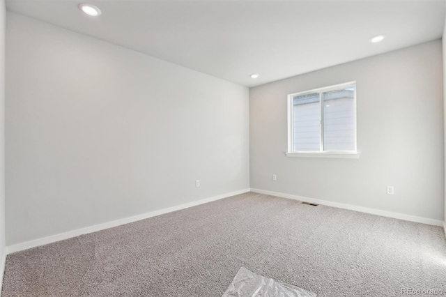 view of carpeted spare room