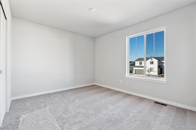 view of carpeted spare room