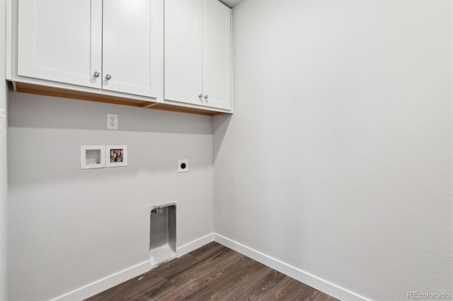 clothes washing area with hookup for an electric dryer, dark hardwood / wood-style flooring, cabinets, and washer hookup