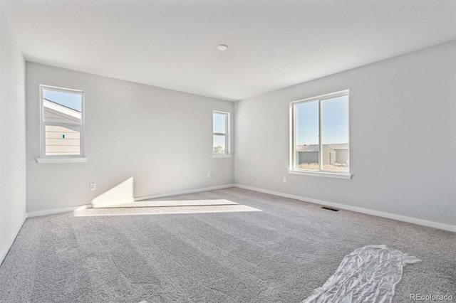 unfurnished room featuring carpet floors