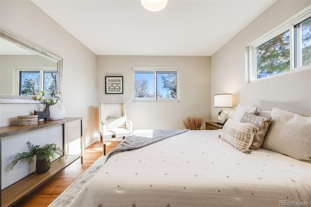 bedroom with hardwood / wood-style flooring