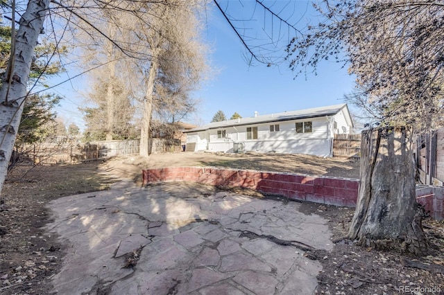 rear view of property with a patio