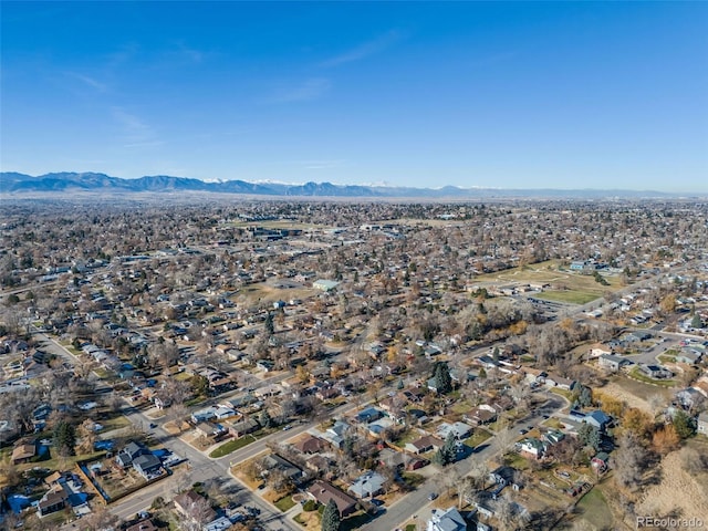 birds eye view of property with a mountain view