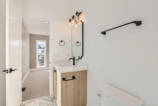 bathroom featuring toilet and vanity