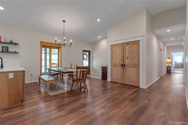 19745 Hopi Pines Grv, Peyton, CO 80831 - dining area featuring dark wood-style flooring, a chandelier, recessed lighting, and vaulted ceiling
