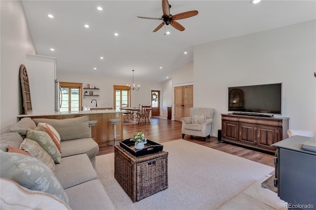 19745 Hopi Pines Grv, Peyton, CO 80831 - living area with a chandelier, light wood-style flooring, recessed lighting, ceiling fan, and high vaulted ceiling