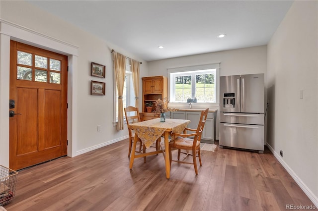 19745 Hopi Pines Grv, Peyton, CO 80831 - dining space featuring light wood finished floors and recessed lighting