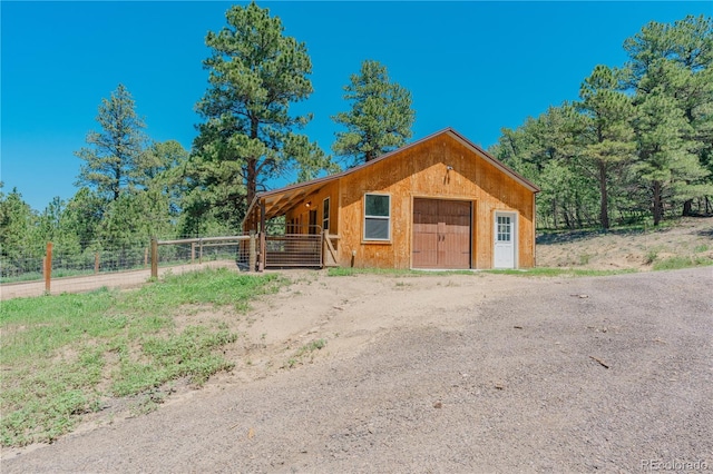 19745 Hopi Pines Grv, Peyton, CO 80831 - view of front facade featuring an exterior structure and an outdoor structure