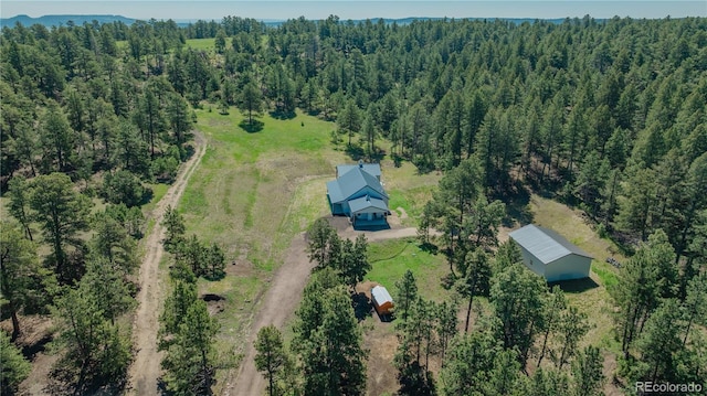 19745 Hopi Pines Grv, Peyton, CO 80831 - aerial view of property and surrounding area with a heavily wooded area