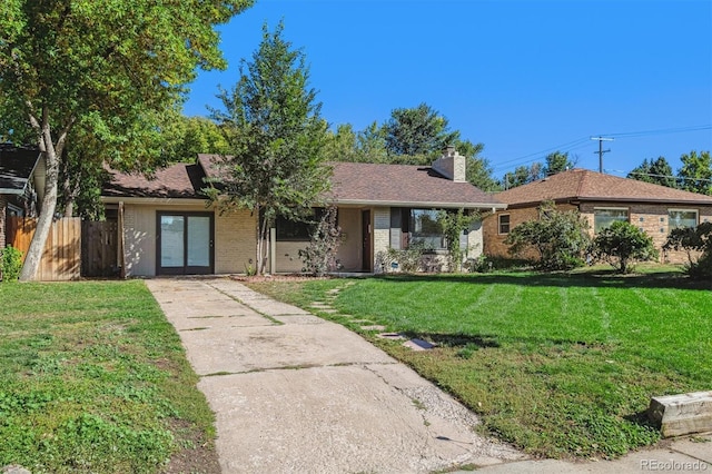 ranch-style home with a front lawn