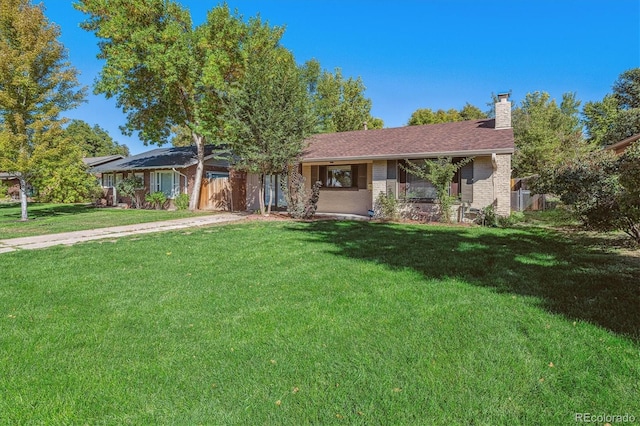 ranch-style house featuring a front lawn