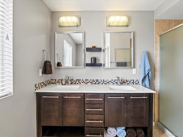 3368 Cranston Cir, Highlands Ranch, CO 80126 - full bath featuring double vanity, a shower with shower door, and tasteful backsplash