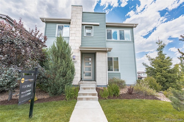 3368 Cranston Cir, Highlands Ranch, CO 80126 - view of front facade with a front lawn and a chimney