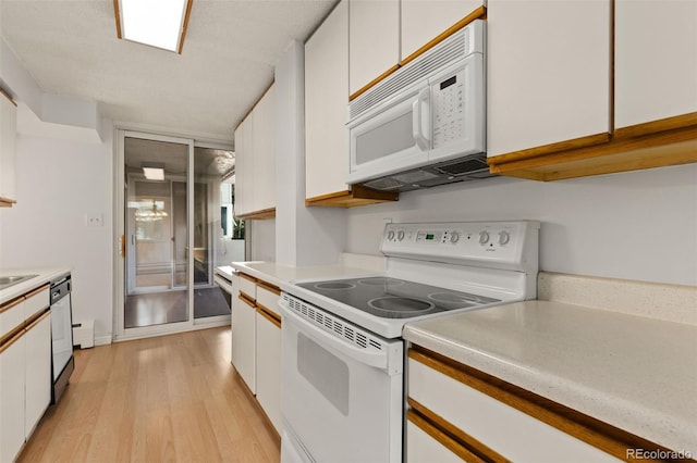 kitchen featuring white cabinetry, white appliances, and light hardwood / wood-style flooring