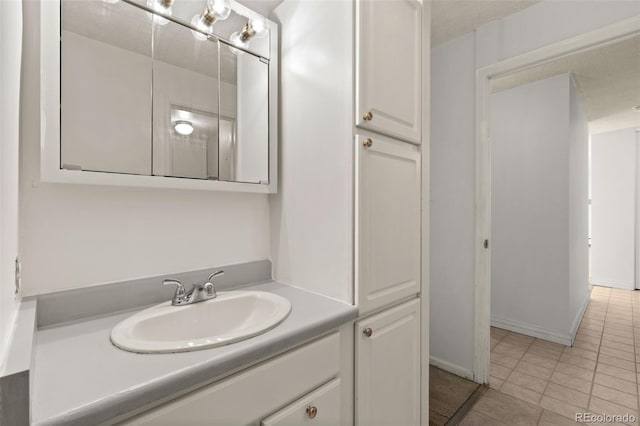 bathroom with vanity and tile patterned flooring