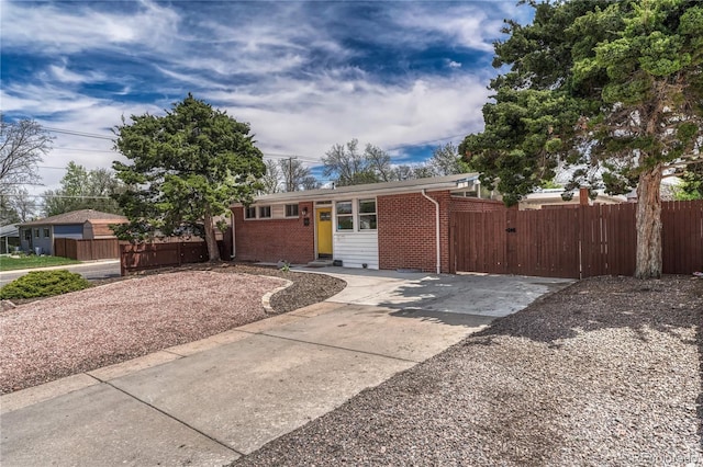 1906 S Vrain St, Denver, CO 80219 - view of front of property featuring brick siding, a gate, and fence