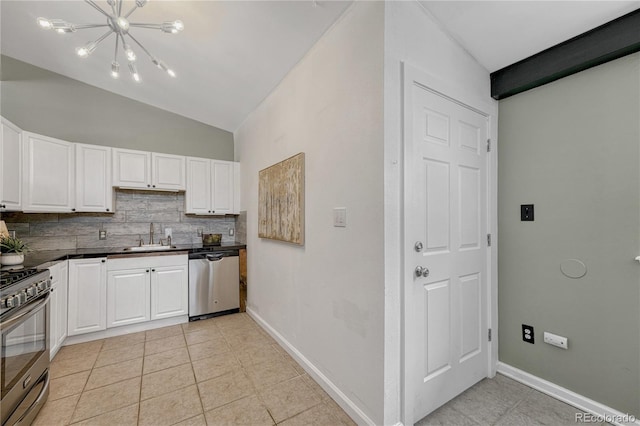 1906 S Vrain St, Denver, CO 80219 - kitchen with appliances with stainless steel finishes, tasteful backsplash, lofted ceiling, white cabinets, and a chandelier