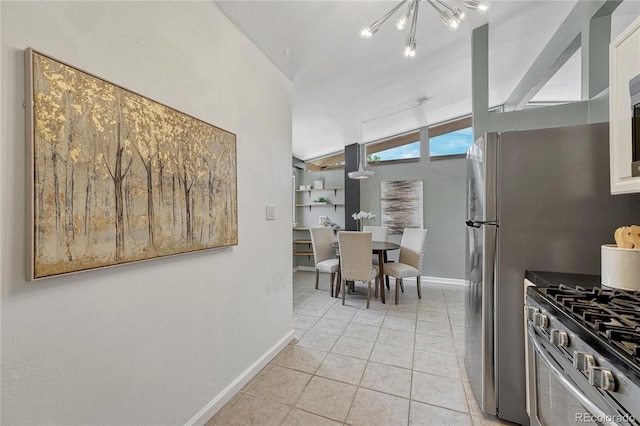 1906 S Vrain St, Denver, CO 80219 - kitchen with vaulted ceiling, gas stove, light tile patterned floors, baseboards, and a chandelier