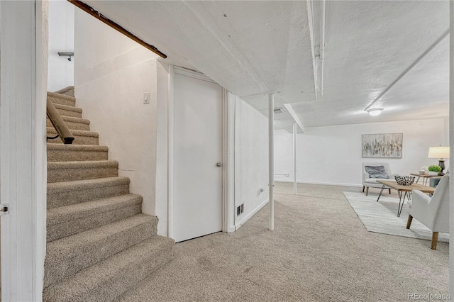 1906 S Vrain St, Denver, CO 80219 - finished below grade area with stairway, carpet floors, a textured ceiling, and baseboards