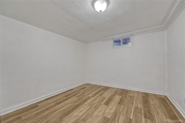 1906 S Vrain St, Denver, CO 80219 - unfurnished room with light wood-style floors, baseboards, and a textured ceiling