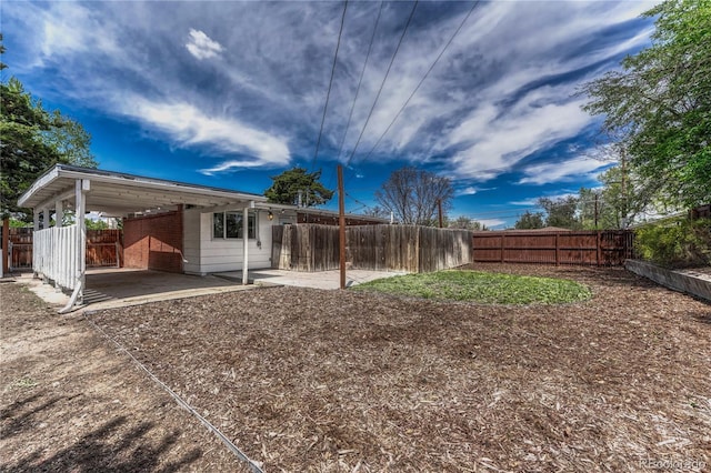 1906 S Vrain St, Denver, CO 80219 - fenced backyard featuring a patio