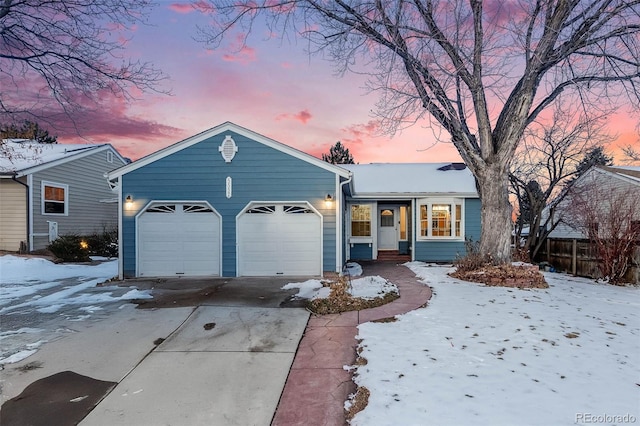 ranch-style house featuring a garage