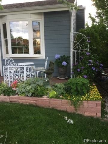 view of outdoor structure featuring a lawn