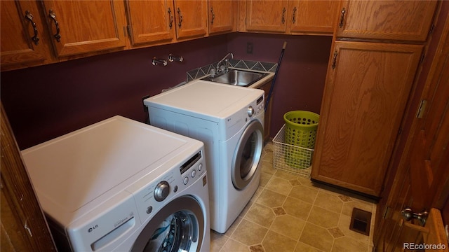 16639 E Berry Ln, Centennial, CO 80015 - laundry area featuring cabinet space, separate washer and dryer, and light tile patterned floors