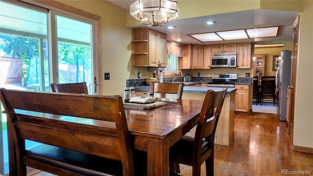 16639 E Berry Ln, Centennial, CO 80015 - dining space with healthy amount of natural light, dark wood-style flooring, a chandelier, and recessed lighting